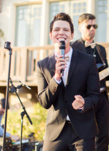 Wedding singer smiling for the camera