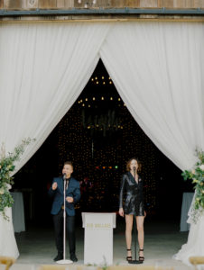 Beautiful drapes and lighting for barn wedding